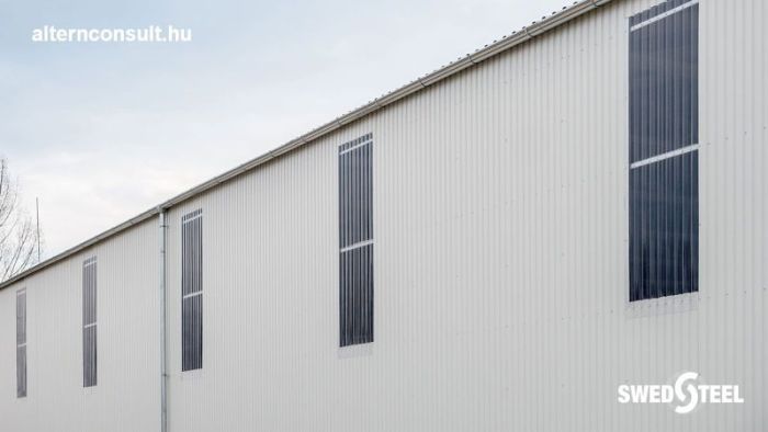 Pellérd. Insulation-free warehouse with Swedsteel trapezoidal plate, natural lighting and illumination strips. Z150 and Z200 roof slats, C120 wall rails, STR45 / 0.5 roof trapezoidal sheet with PE25 coating + anti-condensation film layer, STW20 / 0.5 wall plaster with PE25 coating and SBV20PC lightstrips